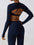 Ensemble de yoga femme – Top moulant avec brassière intégrée & manches pouce